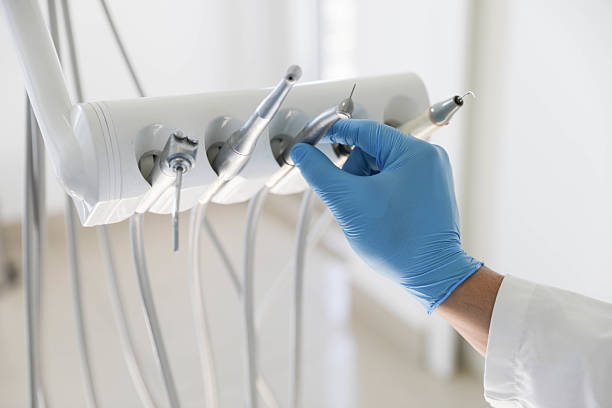 Professional Tooth Extraction technician working in Golden Glades, FL